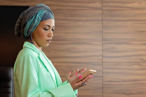 Woman trying to recharge Airtel Bundle on her phone