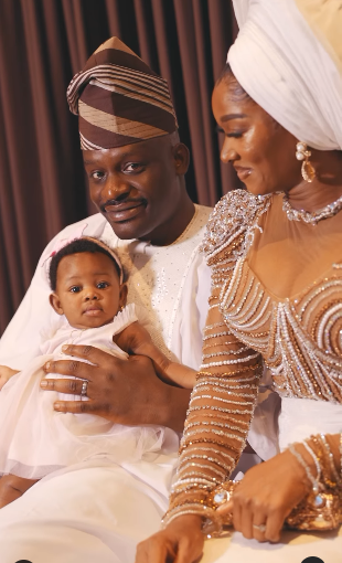 Wofai Fada and Taiwo Cole unveil their baby's face as they celebrate her dedication